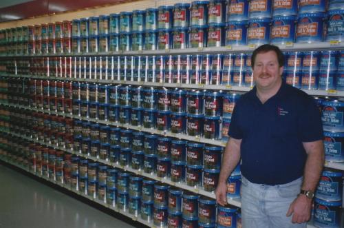 Greg-with-a-paint-merchandise-setup