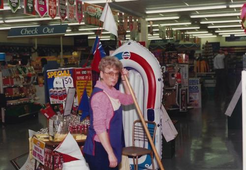 Jo-sweeping-an-aisle